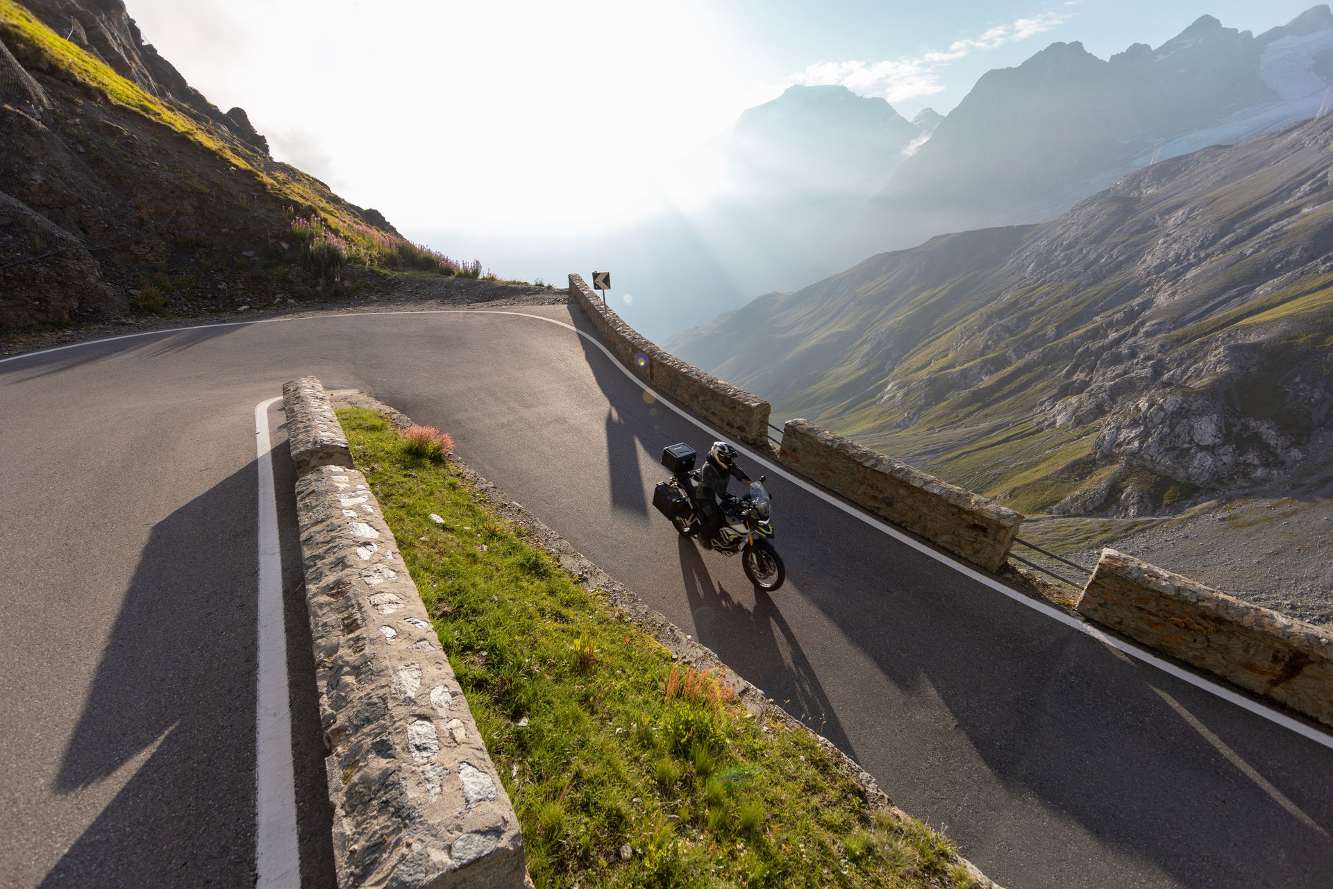 Motorbiker riding in Italian Alps